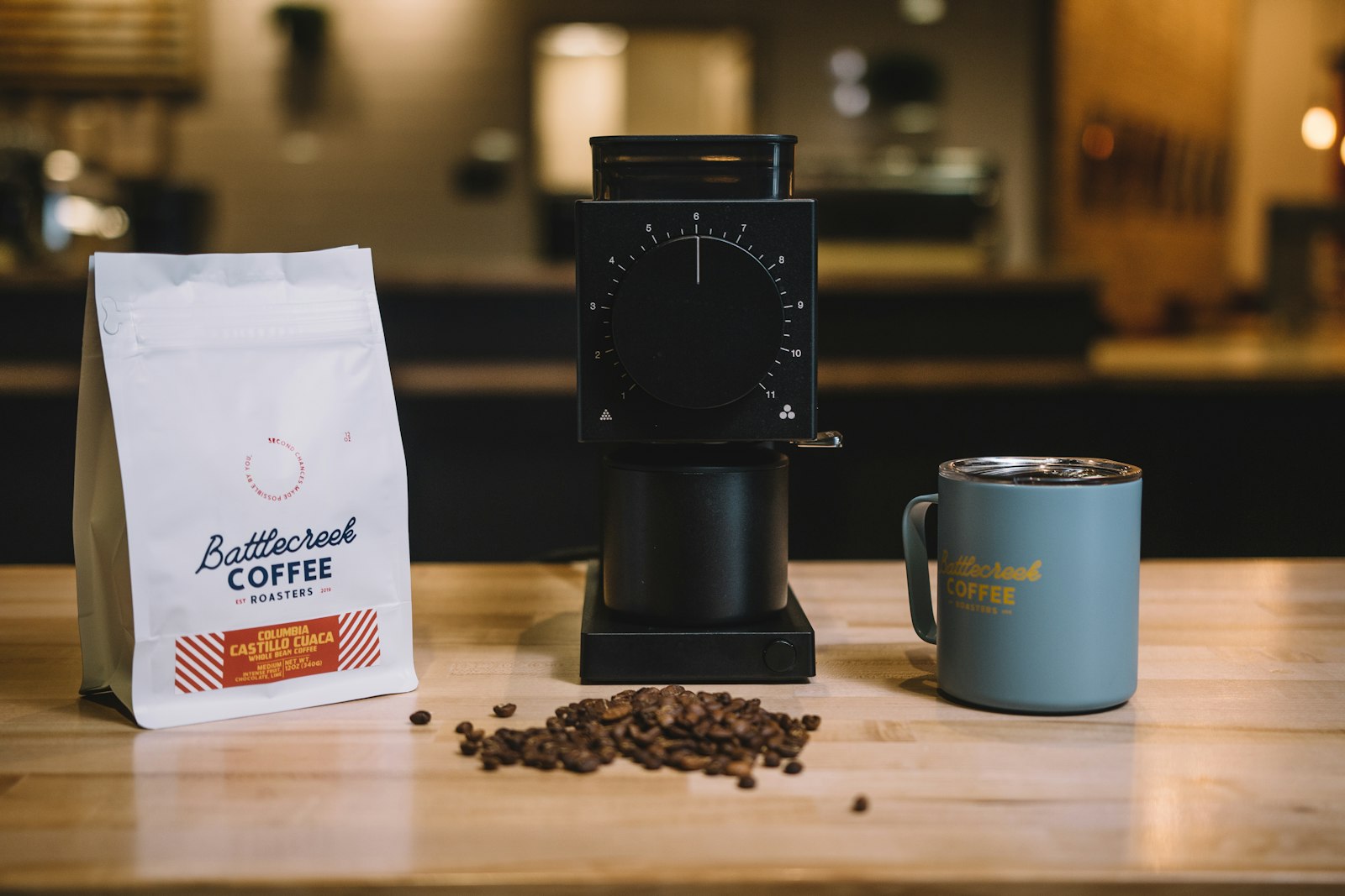 Single cup brewer next to a coffee bag